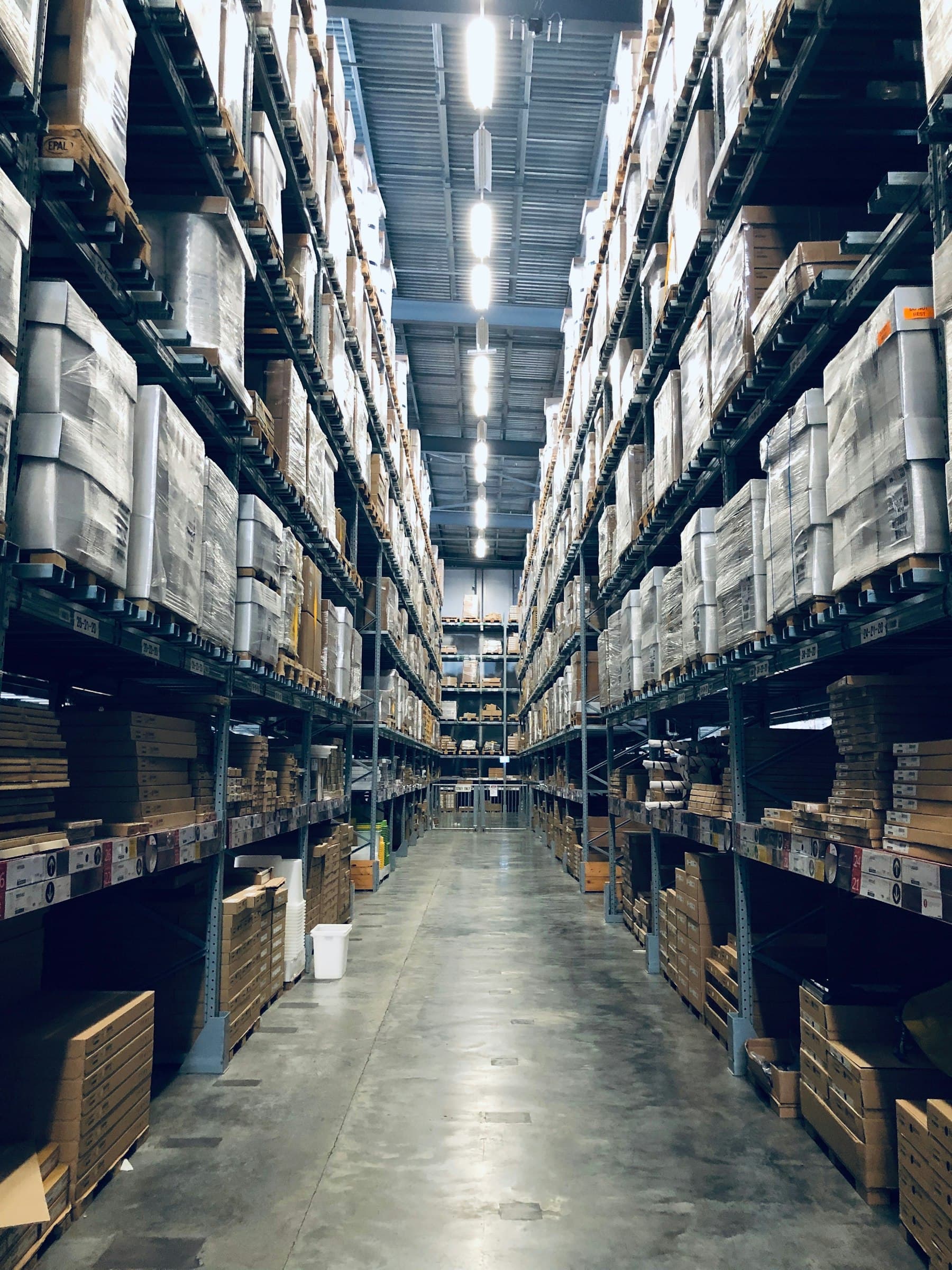 Aisle between high pallet racking in a warehouse