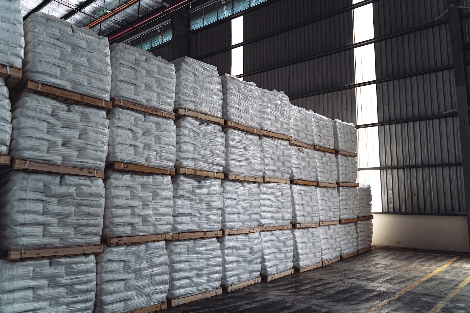 Bales stacked on pallets in a warehouse store
