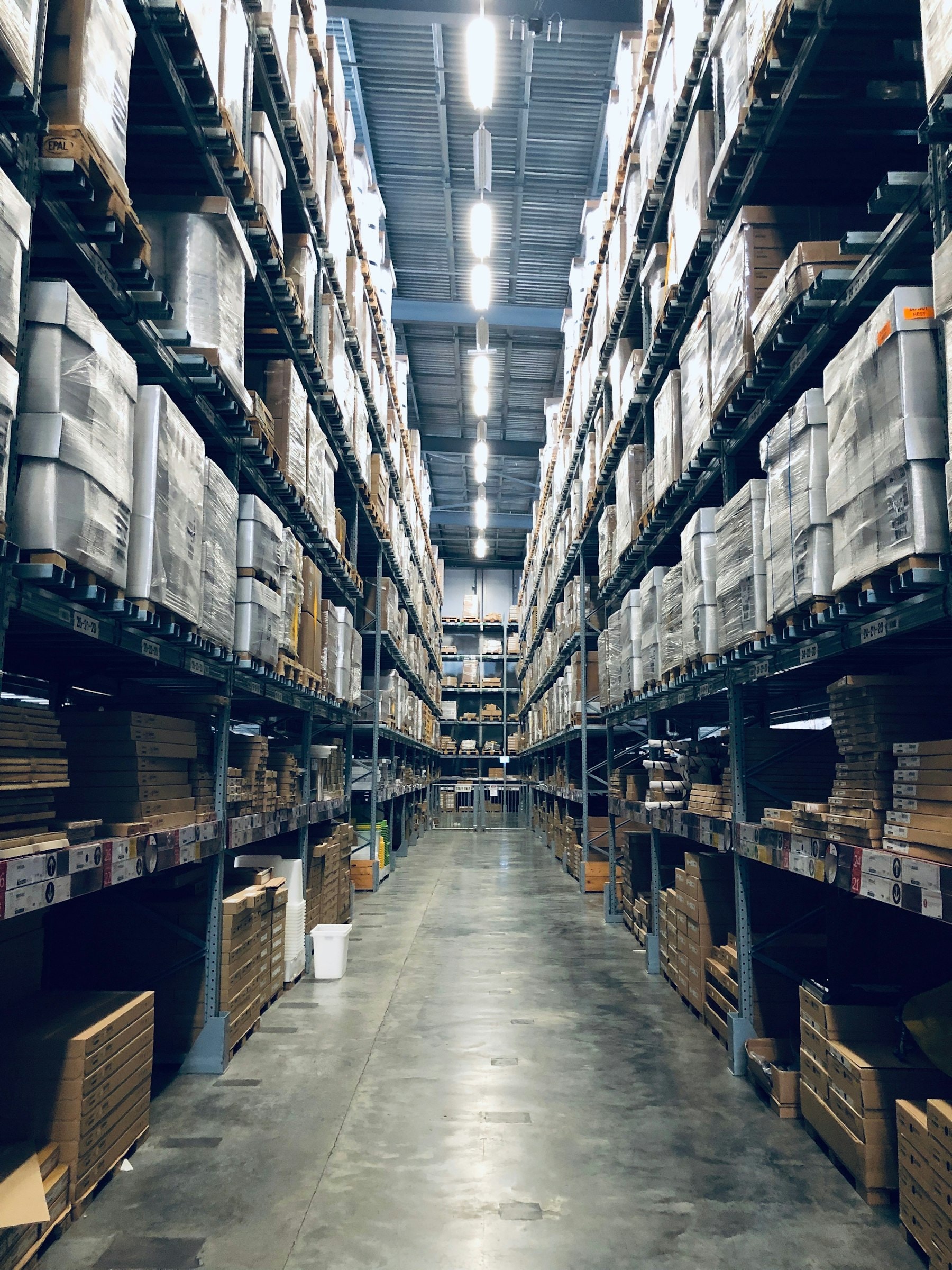 Aisle between high pallet racking in a warehouse